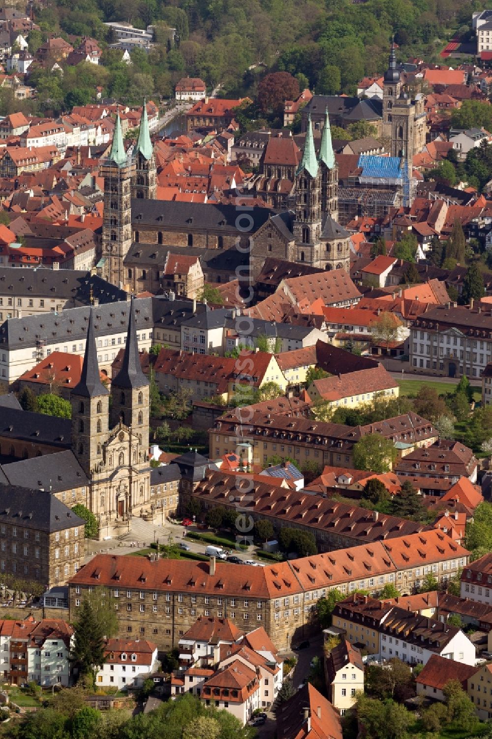 Bamberg from above - View of the monastery Michelsberg in Bamberg in Bavaria. The Michel Monastery mountain, which is also called Michael and was founded in 1015, is a former Benedictine monastery in the diocese of Bamberg. After its dissolution in 1803, the premises of the nursing home United Catherine and Elizabeth Hospital moved there