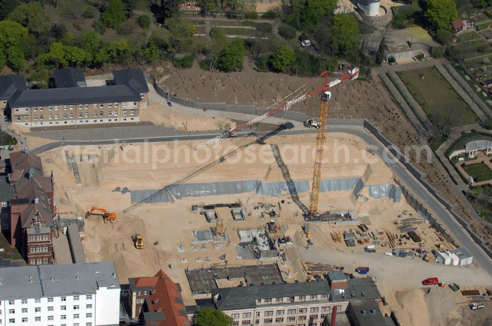 BRANDENBURG from the bird's eye view: Blick auf das Areal der Tiefbauarbeiten zum Erweiterungsbau des Krankenhaus Brandenburg an der Havel.Hier entstehen u.a. durch die Firma BATEG Ingenieurbau ein neues Bettenhaus auf der Grundlage des Entwurfes des Architekturbüros Heinle, Wischer und Partner, Berlin.