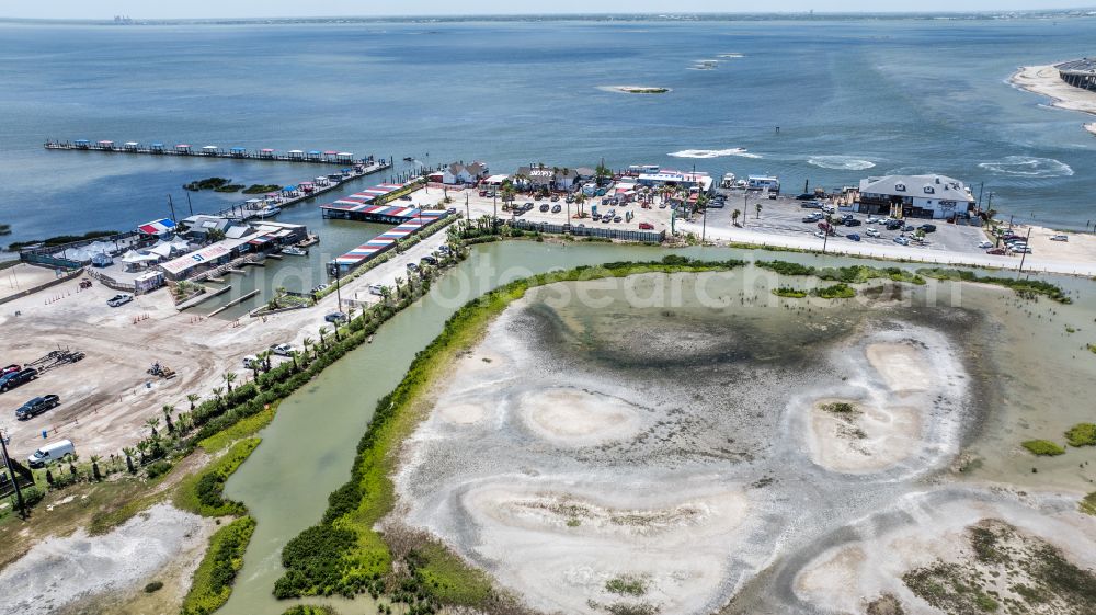 Aerial image Corpus Christi - Tables and benches of open-air restaurant Doc's Seafood and Steaks, Snoopy's Pier and The Pearl on street South Padre Island Drive in Corpus Christi in Texas, United States of America