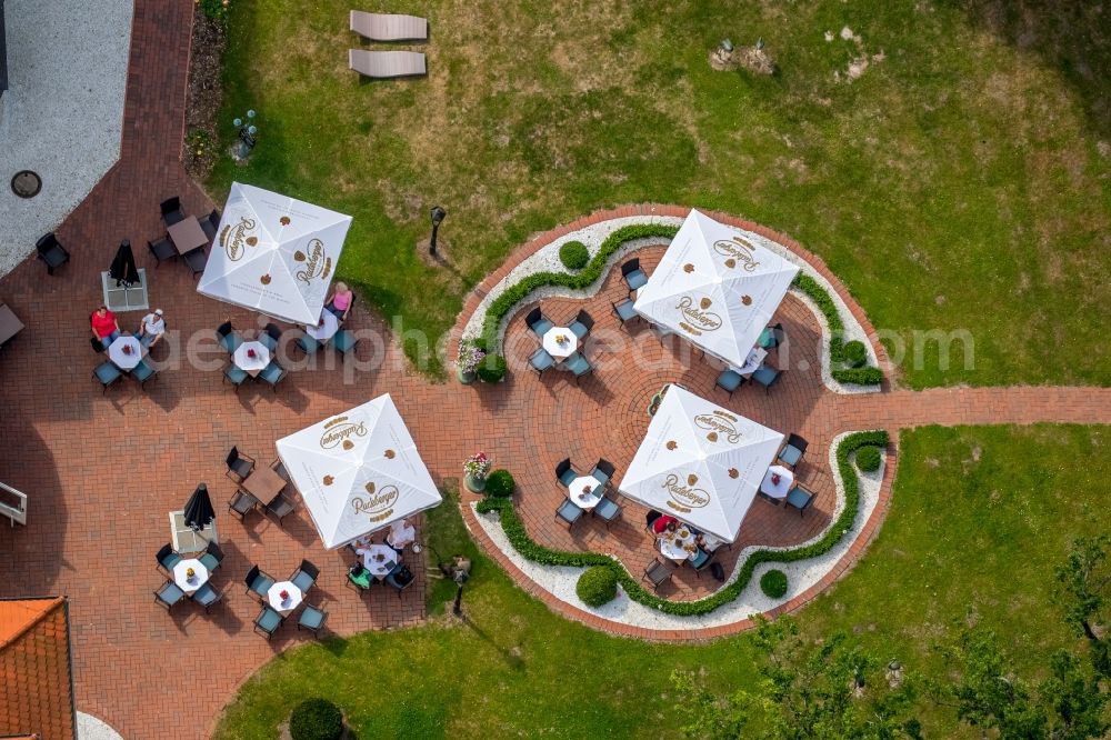 Aerial image Schorssow - Tables and benches of open-air restaurant of the Hotel Seeschloss Schorssow at Haussee in Schorssow in the state Mecklenburg - Western Pomerania