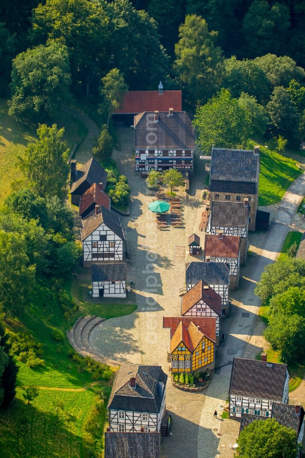 Hagen from above - Tables and benches of open-air restaurants Gasthof zur Post in the middle of the LWL Freilichtmuseum in Hagen in the state North Rhine-Westphalia