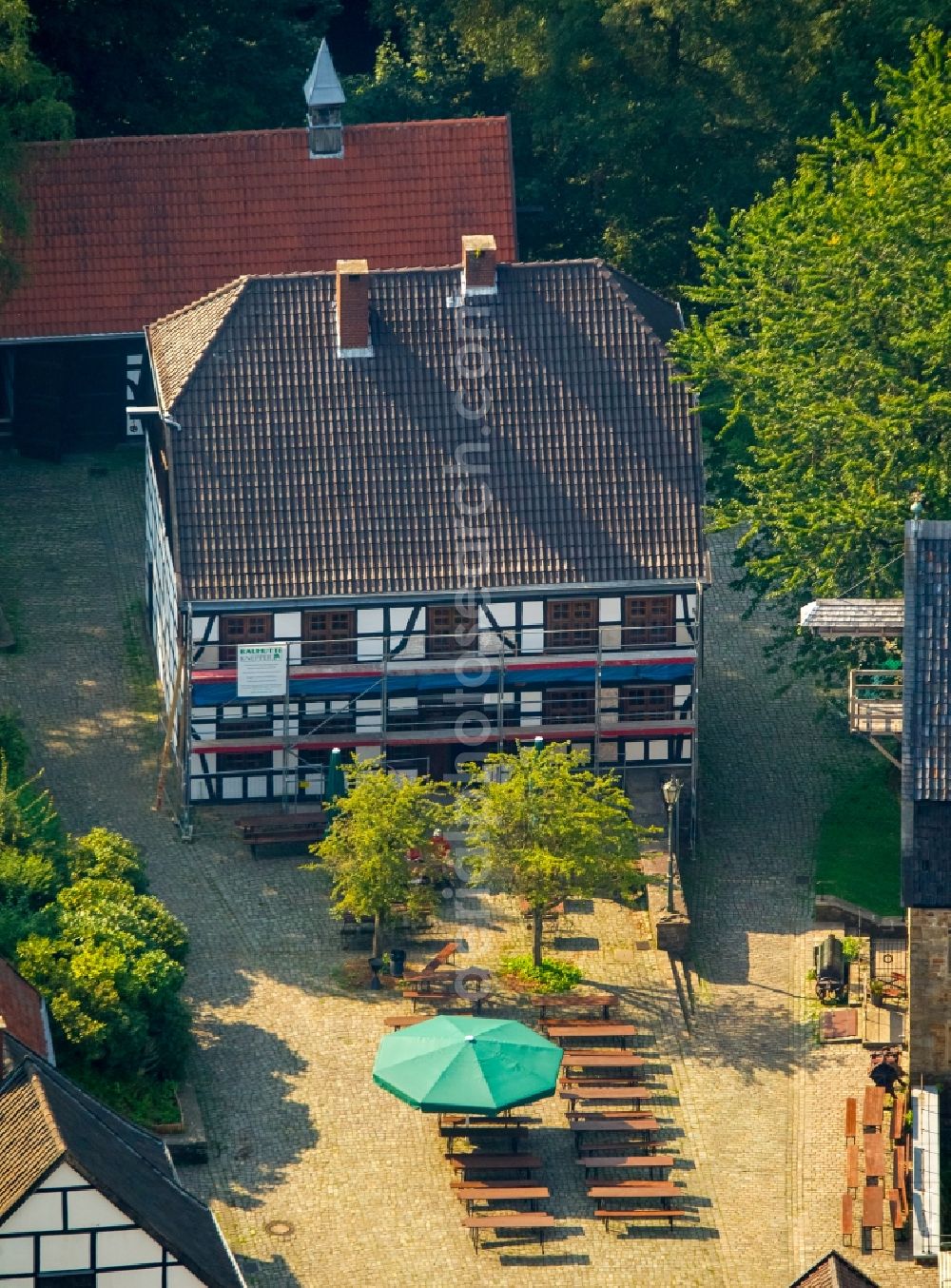 Aerial image Hagen - Tables and benches of open-air restaurants Gasthof zur Post in the middle of the LWL Freilichtmuseum in Hagen in the state North Rhine-Westphalia