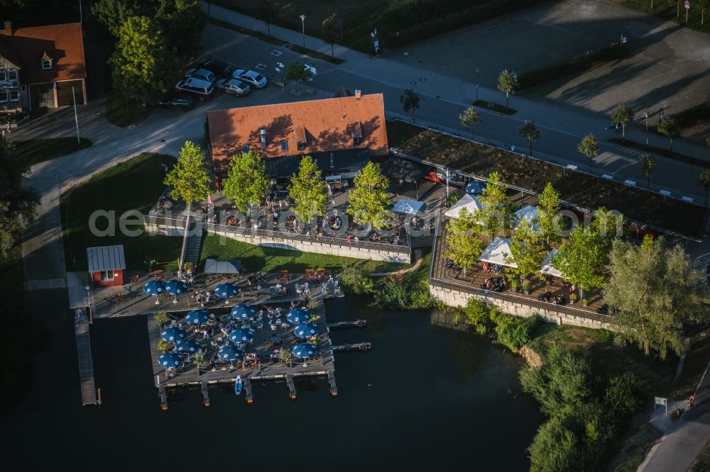 Spalt from above - Tables and benches of open-air restaurants Grosser Brombachsee in Spalt in the state Bavaria, Germany