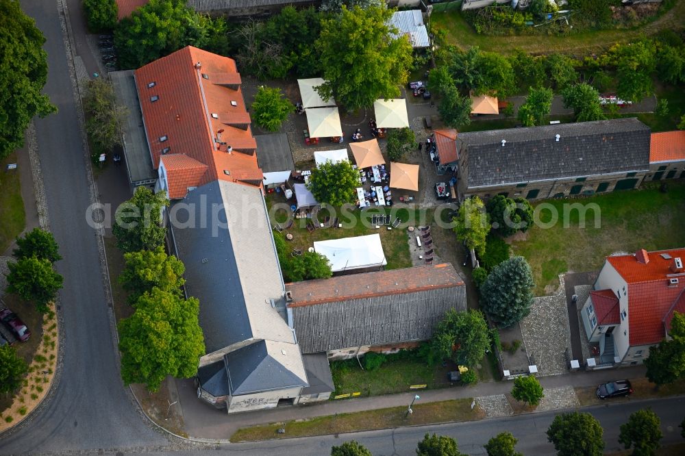 Petershagen/Eggersdorf from the bird's eye view: Tables and benches of open-air restaurants Madels on Dorfstrasse in Petershagen/Eggersdorf in the state Brandenburg, Germany