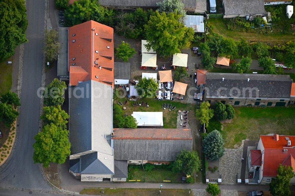 Aerial image Petershagen/Eggersdorf - Tables and benches of open-air restaurants Madels on Dorfstrasse in Petershagen/Eggersdorf in the state Brandenburg, Germany