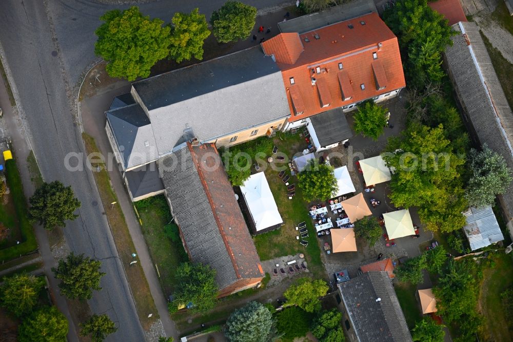 Aerial photograph Petershagen/Eggersdorf - Tables and benches of open-air restaurants Madels on Dorfstrasse in Petershagen/Eggersdorf in the state Brandenburg, Germany