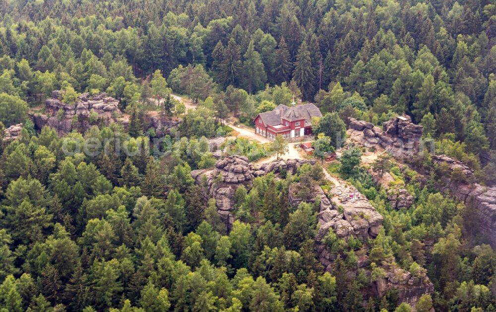 Oybin from above - Tables and benches of open-air restaurants Toepferbaude in Oybin in the state Saxony, Germany