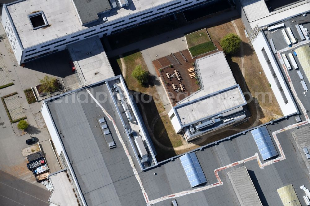 Berlin from above - Tables and benches of open-air restaurants Am Wriezener Bahnhof in the district Friedrichshain in Berlin, Germany