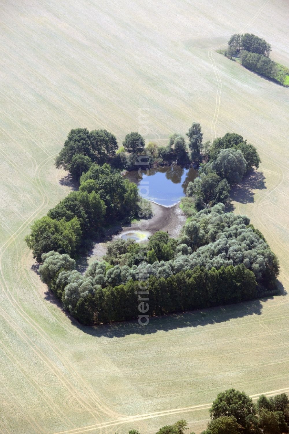 Lindendorf from the bird's eye view: Pool oases on harvested agricultural fields in Lindendorf in the state Brandenburg