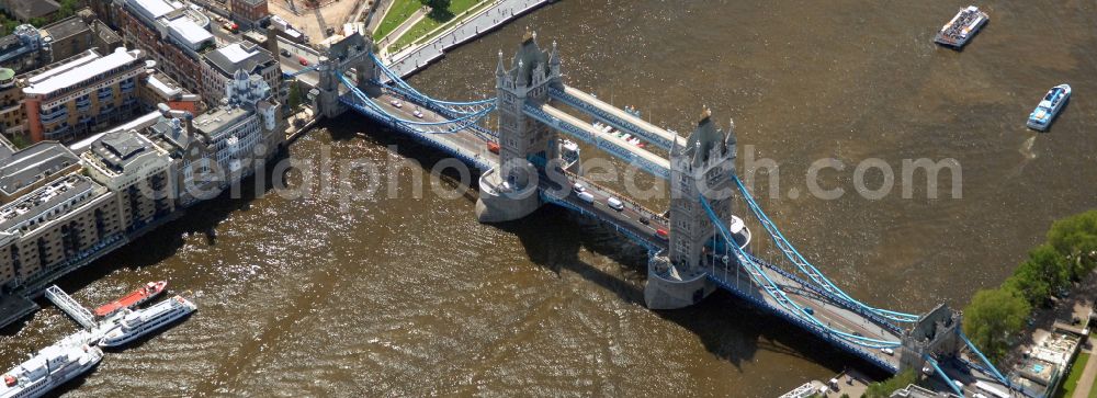 London from the bird's eye view: River - bridge structure and landmark of the Victorian bascule and suspension bridge Tower Bridge for crossing the river Thames on Tower Bridge Rd in London in England, United Kingdom