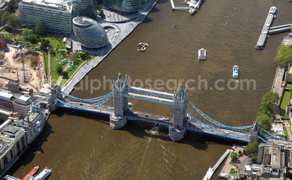 London from the bird's eye view: River - bridge structure and landmark of the Victorian bascule and suspension bridge Tower Bridge for crossing the river Thames on Tower Bridge Rd in London in England, United Kingdom