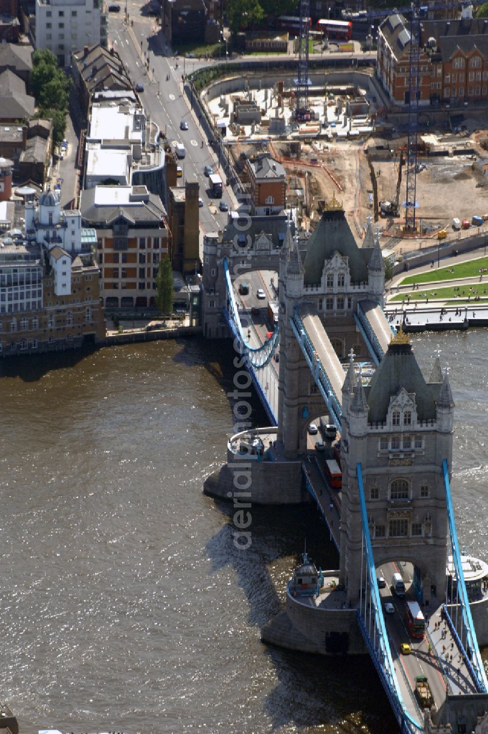 Aerial image London - River - bridge structure and landmark of the Victorian bascule and suspension bridge Tower Bridge for crossing the river Thames on Tower Bridge Rd in London in England, United Kingdom