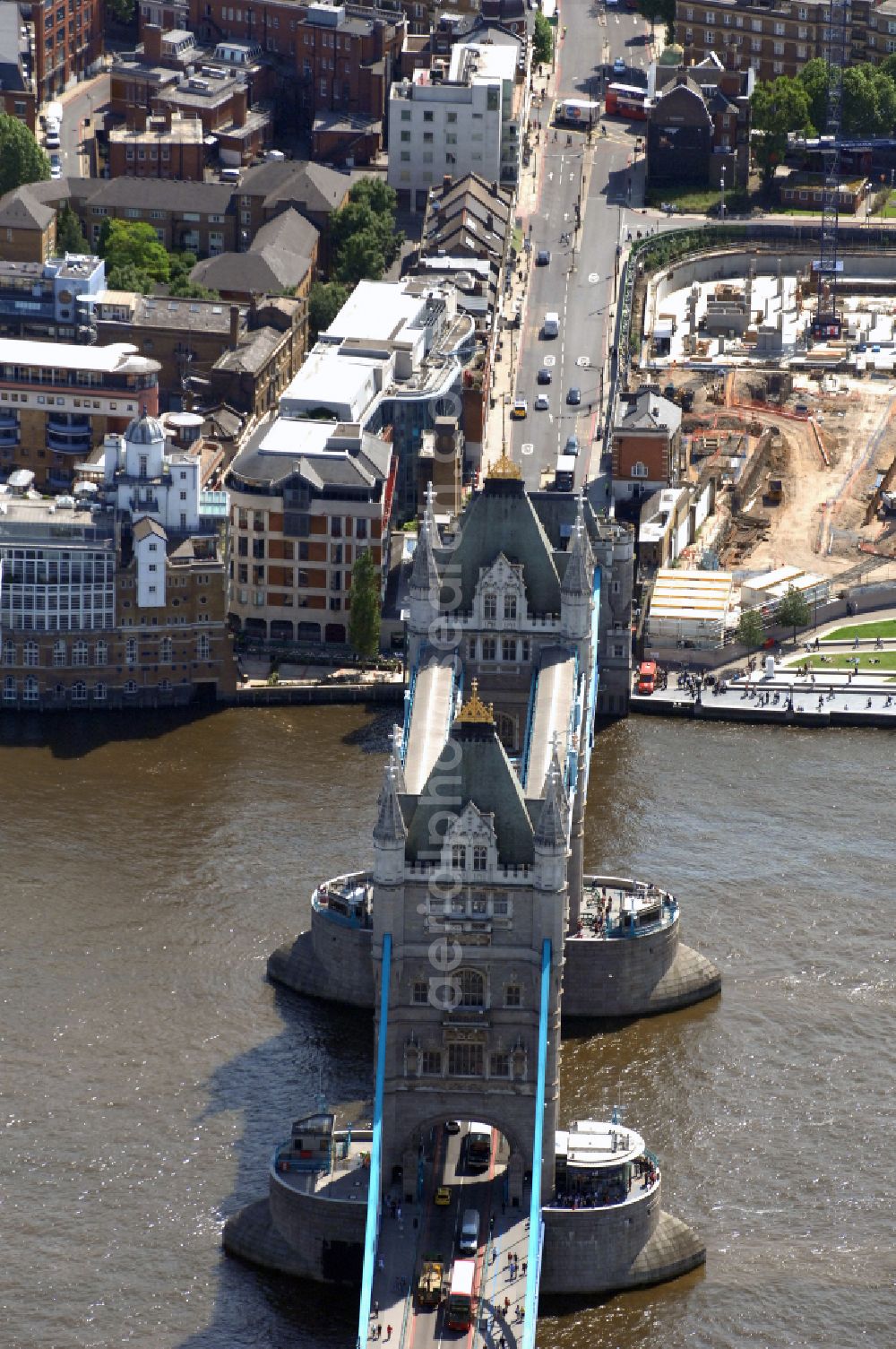 Aerial image London - River - bridge structure and landmark of the Victorian bascule and suspension bridge Tower Bridge for crossing the river Thames on Tower Bridge Rd in London in England, United Kingdom