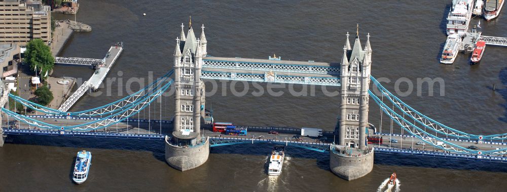 London from the bird's eye view: River - bridge structure and landmark of the Victorian bascule and suspension bridge Tower Bridge for crossing the river Thames on Tower Bridge Rd in London in England, United Kingdom