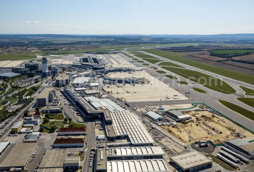 Aerial image Wien - Tower, runway, terminal and taxiways of the airport Vienna Schwechat in Austria