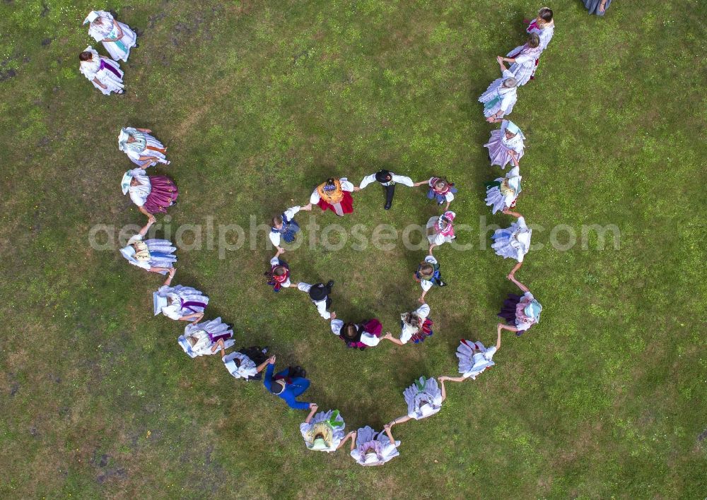 Lübben (Spreewald) from the bird's eye view: Villagers wear traditonal clothes as they dance during a dance festival of the German ethnic minority Sorben, in Luebben (Spreewald) in the state Brandenburg, Germany