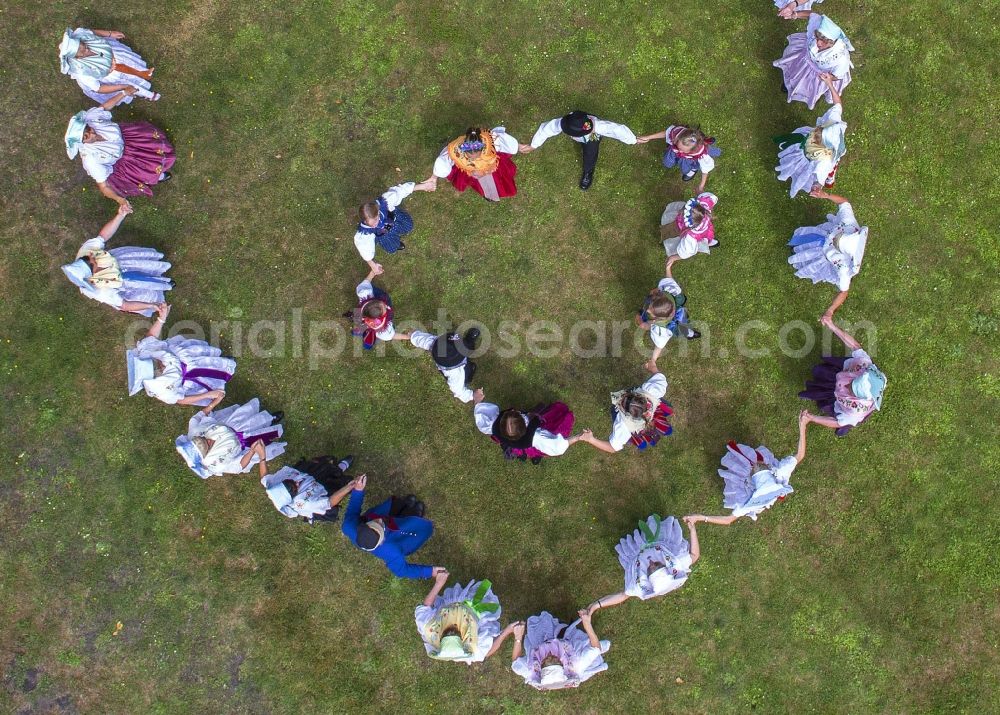 Aerial image Lübben (Spreewald) - Villagers wear traditonal clothes as they dance during a dance festival of the German ethnic minority Sorben, in Luebben (Spreewald) in the state Brandenburg, Germany