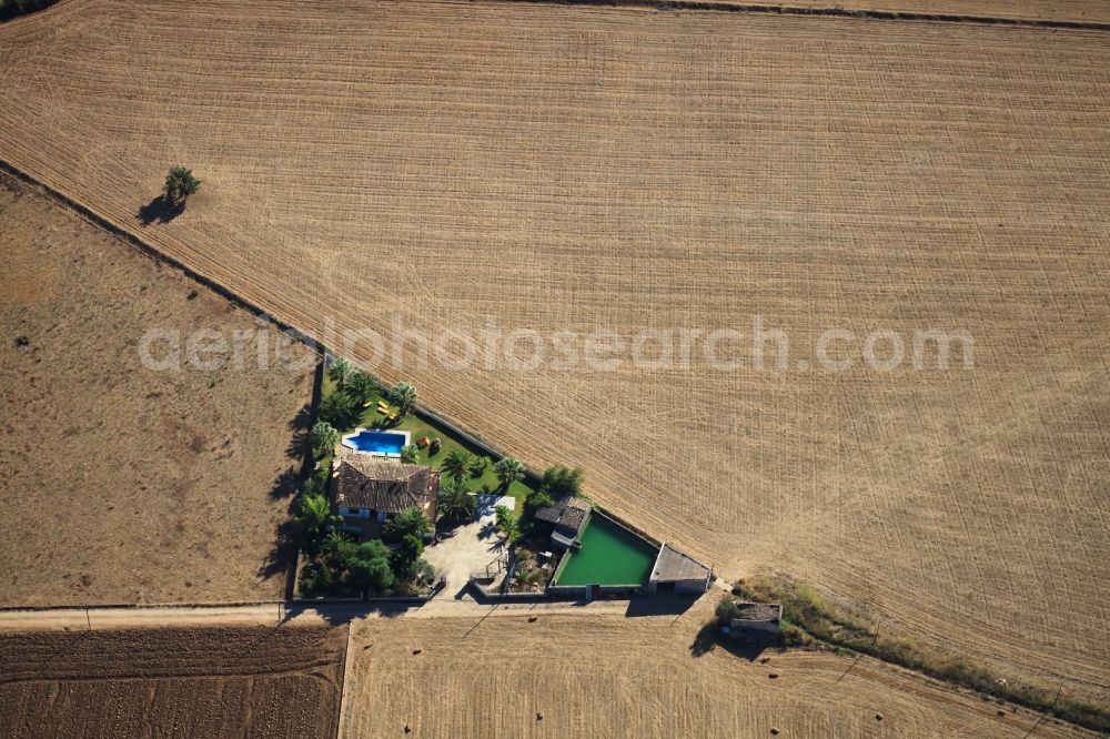 Inca from the bird's eye view: Traditional water - reservoir on the fields of Mallorca at Inca in Balearic Islands, Spain