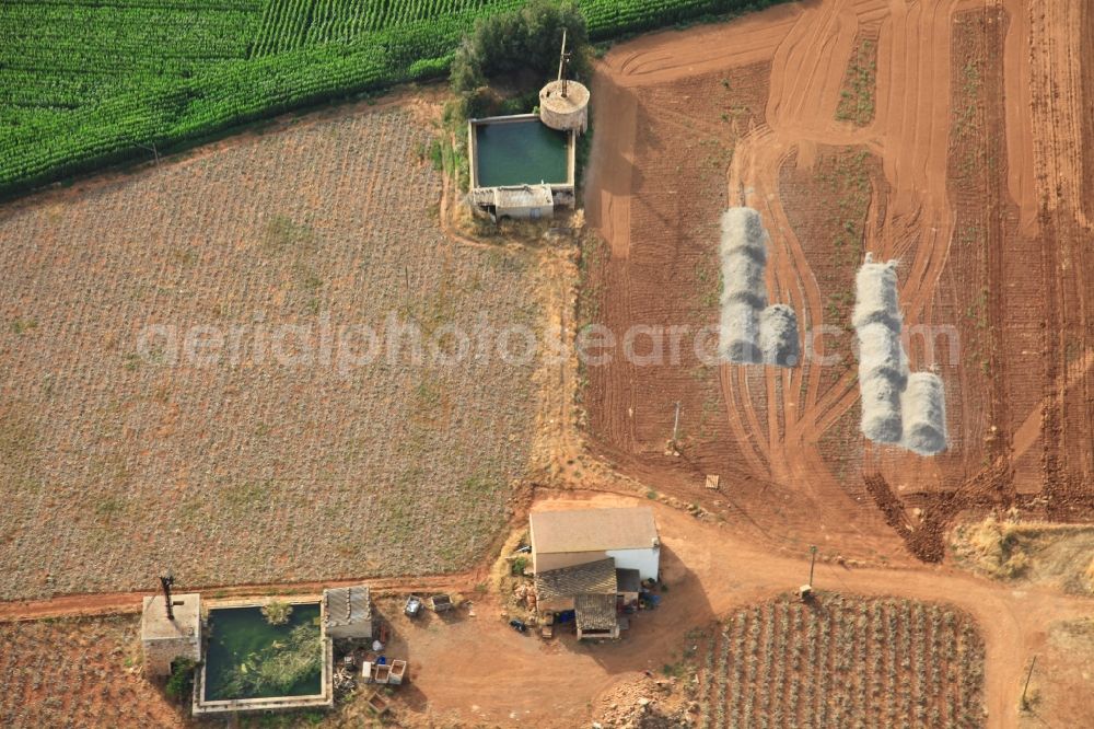 Aerial image Manacor - Traditional water - reservoir on the fields of Mallorca at Manacor in Balearic Islands, Spain