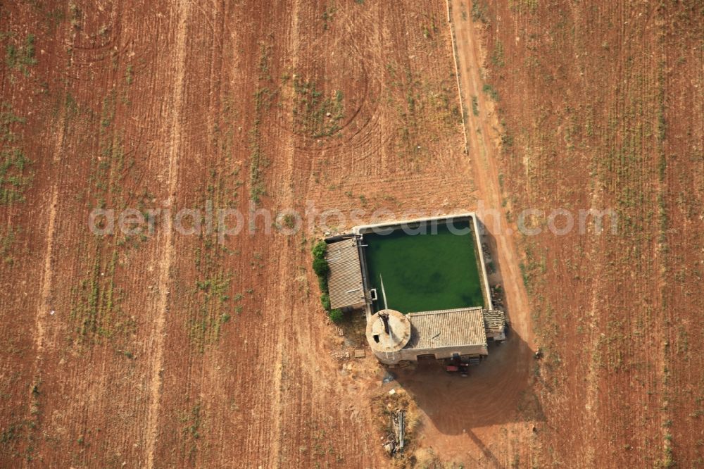 Aerial photograph Manacor - Traditional water - reservoir on the fields of Mallorca at Manacor in Balearic Islands, Spain