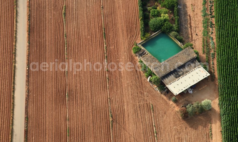 Aerial image Manacor - Traditional water - reservoir on the fields of Mallorca at Manacor in Balearic Islands, Spain