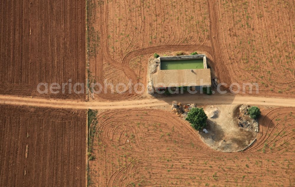 Manacor from above - Traditional water - reservoir on the fields of Mallorca at Manacor in Balearic Islands, Spain