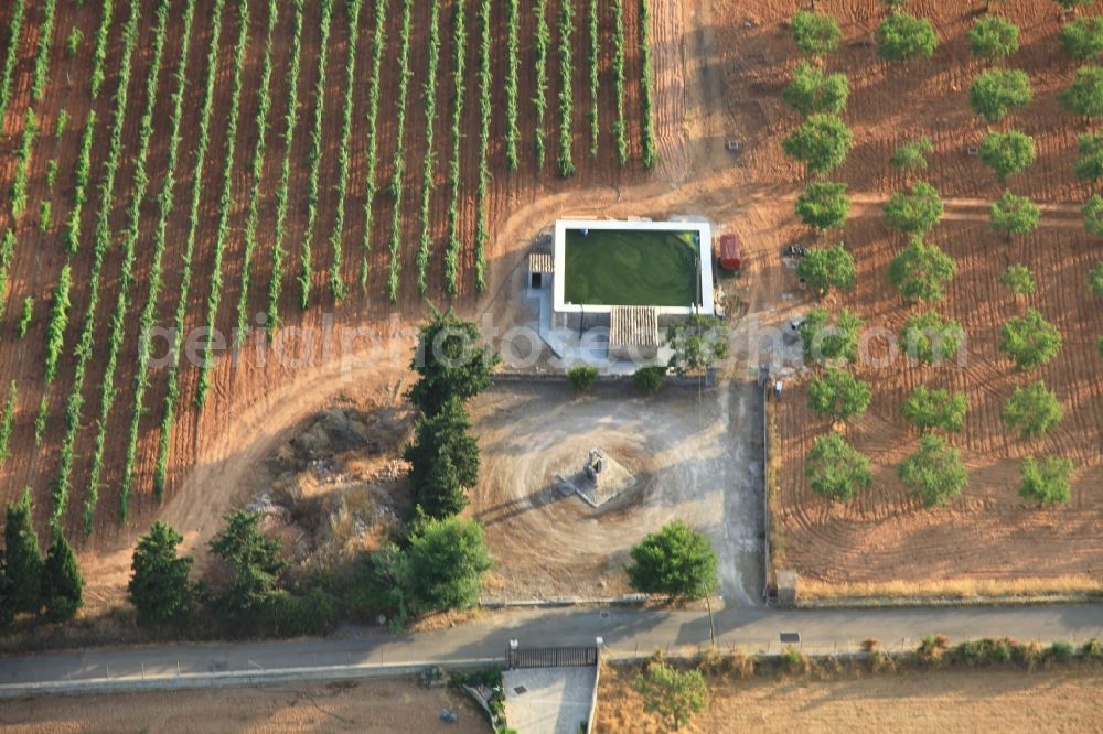 Manacor from the bird's eye view: Traditional water - reservoir on the fields of Mallorca at Manacor in Balearic Islands, Spain