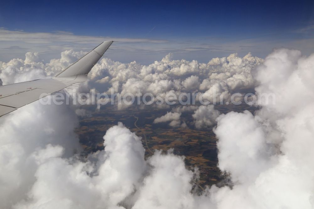 Aerial image Odelzhausen - The wing of an airliner Bombardier CRJ900 of Lufthansa CityLine in flight above the clouds in the area of Odelzhausen in the state of Bavaria