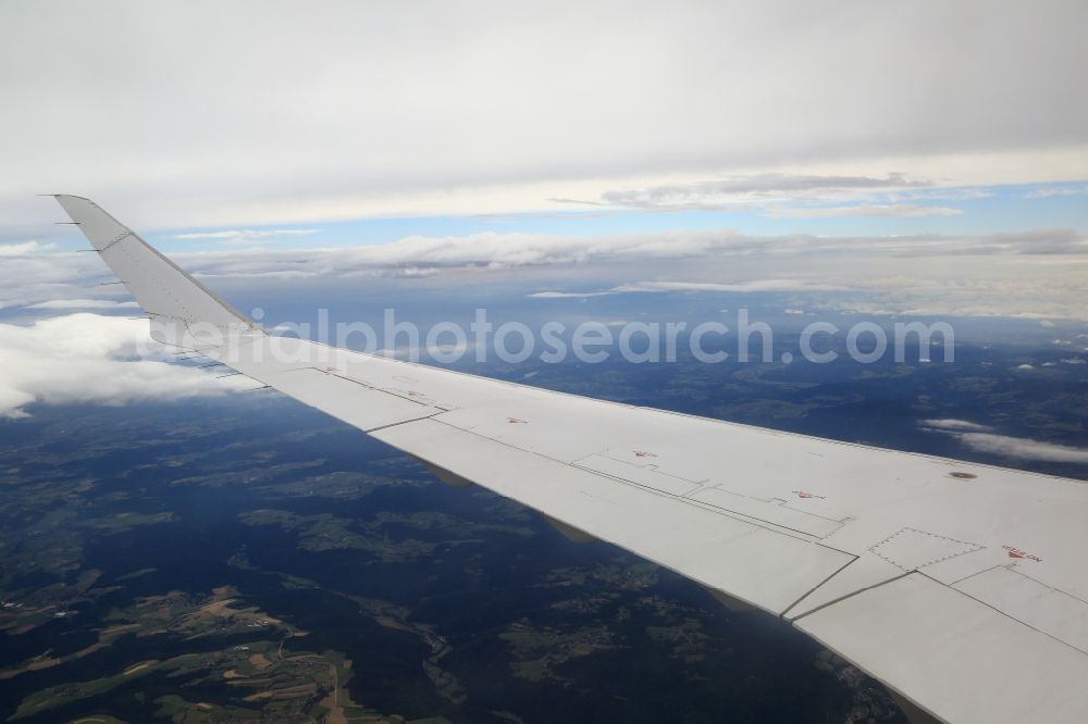 Aerial image Höchenschwand - The wing of an airliner Bombardier CRJ900 of Lufthansa CityLine in flight above the clouds in the area of Hoechenschwand in the state of Baden-Wuerttemberg