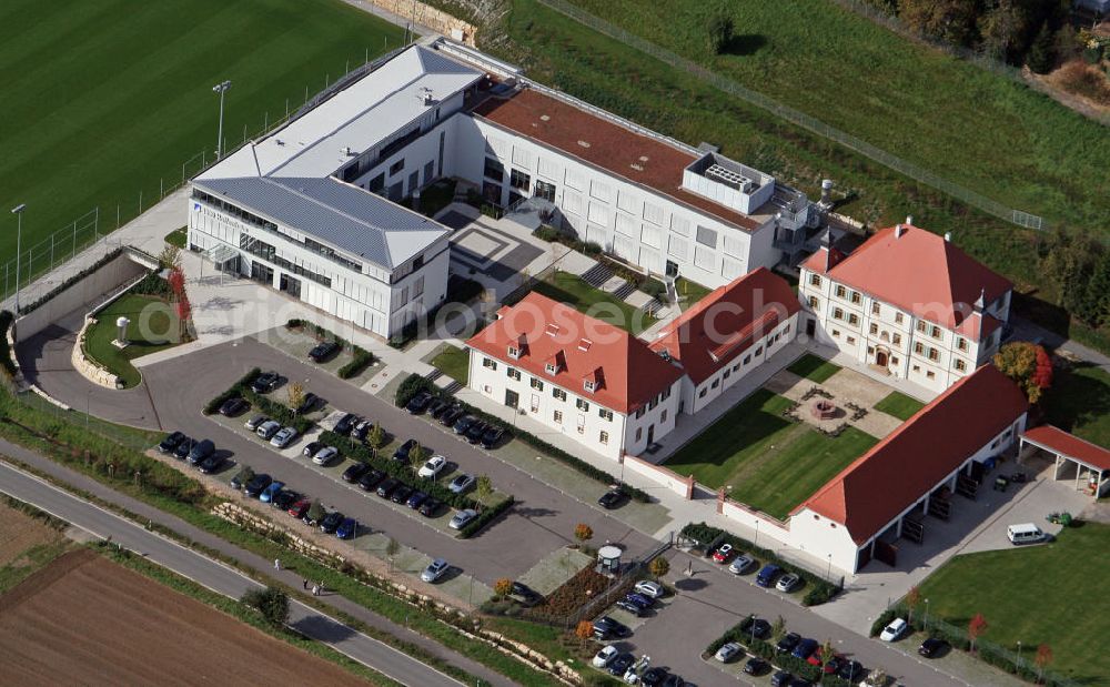 Aerial photograph Zuzenhausen - Das Trainings- und Geschäftsstellenzentrum der TSG 1899 Hoffenheim am Dietmar-Hopp-Sportpark. Das moderne Trainingszentrum wurde im Herbst 2009 fertiggestellt. Im benachbarten Schlossgebäude wird die U23 betreut. The training center and offices of TSG 1899 Hoffenheim on Dietmar-Hopp-sports park.