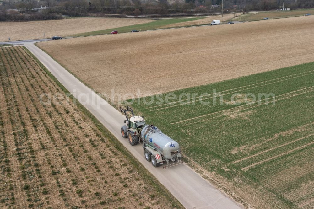 Aerial photograph Bietigheim-Bissingen - Harvest use of heavy agricultural machinery - combine harvesters and harvesting vehicles on agricultural fields in Bietigheim-Bissingen im Bundesland Baden-Wuerttemberg