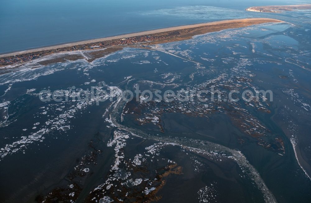 Aerial image Juist - Ice floe pieces of a drift ice layer on the water surface in Wattenmeer of Nordsee vor of Island Juist in the state Lower Saxony, Germany