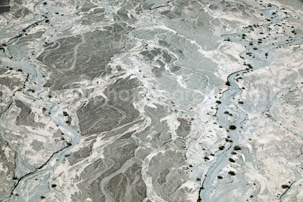 Nazca from the bird's eye view: Landscape of the dry desert deformed by soil erosion and traces of water in Nazca in Ica, Peru