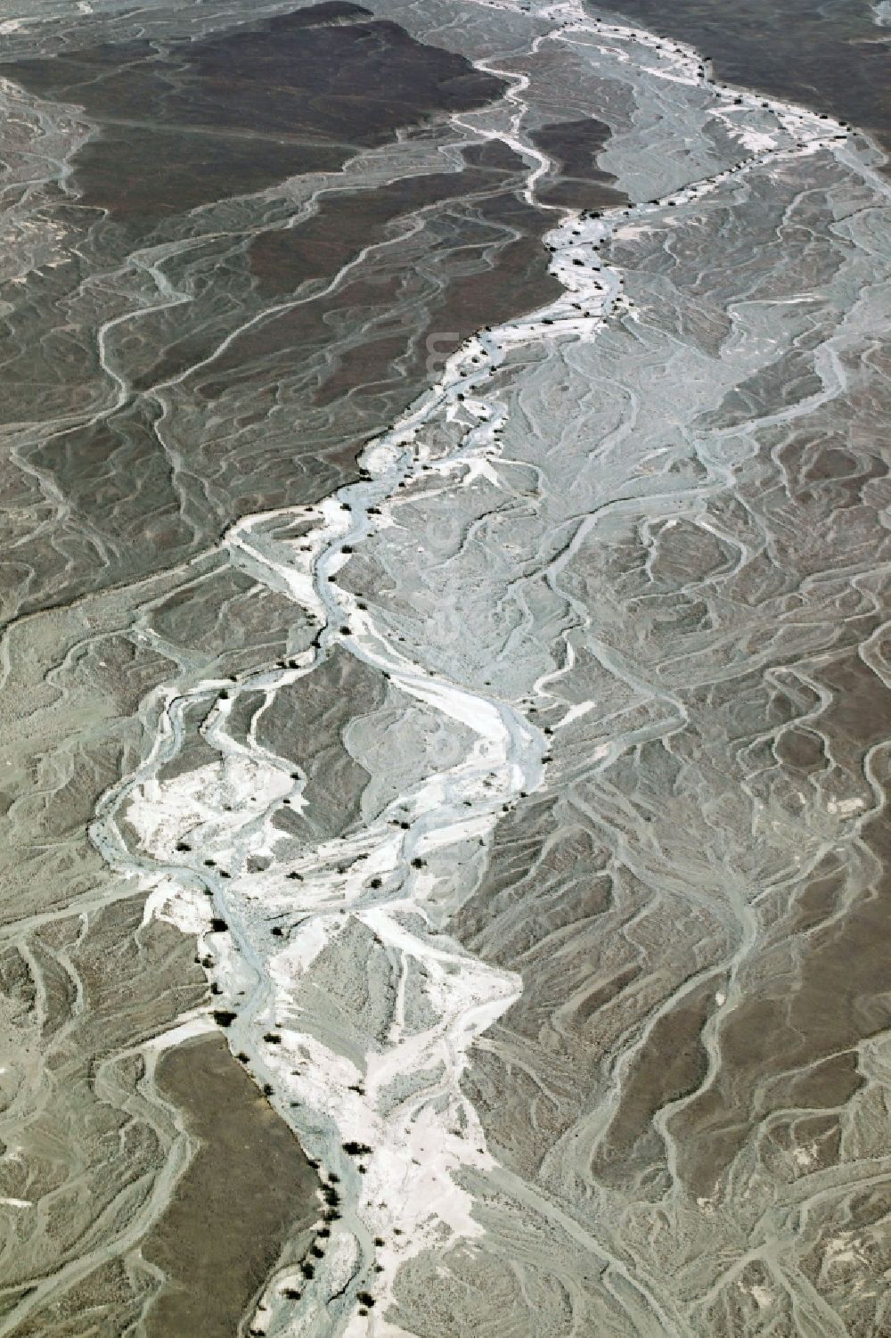 Nazca from the bird's eye view: Landscape of the dry desert deformed by soil erosion and traces of water in Nazca in Ica, Peru