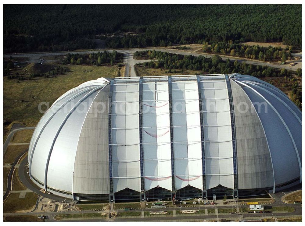 Aerial image Krausnick - Die größte frei tragende Halle der Welt bietet genug Platz für ein Tropenparadies. In den kommenden Monaten findet die Verwandlung vom Cargolifter Hangar, der ehemaligen Produktionsstätte für Transportluftschiffe, zum Tropical Islands Dome mit seinem einzigartigen Attraktionen statt. Tropical Island Management GmbH,Tropical-Islands-Allee 1,15910 Krausnick – Gross Wasserburg,Tel: +49-35477-60-100,Fax: +49-35477-60-3129 ,http://