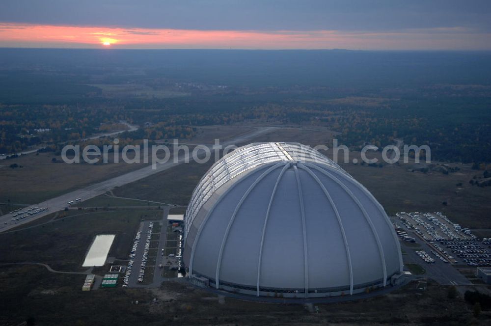 Krausnick from the bird's eye view: Blick auf das Tropical Islands Resort in der Nähe von Krausnick in Brandenburg. Dieses Resort im Licht des Sonnenuntergangs ist ein als künstliche Tropenlandschaft angelegter Freizeitpark in der größten freitragenden Halle der Welt, 60 km südlich von Berlin. Postanschrift: Tropical Island Management GmbH, Tropical-Islands-Allee 1, 15910 Krausnick, Tel. (+49) 03 54 77 - 60 50 50,