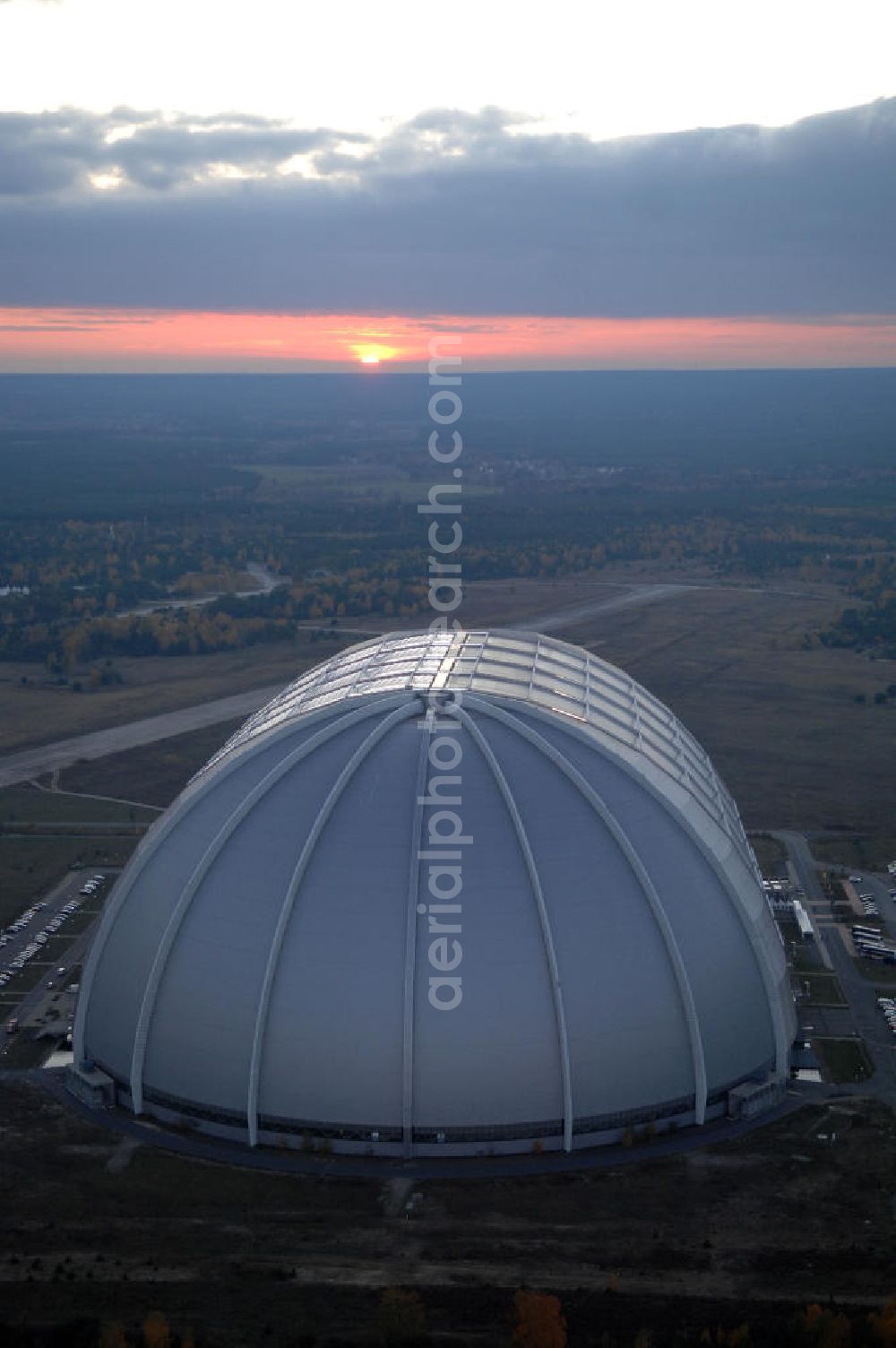 Aerial image Krausnick - Blick auf das Tropical Islands Resort in der Nähe von Krausnick in Brandenburg. Dieses Resort im Licht des Sonnenuntergangs ist ein als künstliche Tropenlandschaft angelegter Freizeitpark in der größten freitragenden Halle der Welt, 60 km südlich von Berlin. Postanschrift: Tropical Island Management GmbH, Tropical-Islands-Allee 1, 15910 Krausnick, Tel. (+49) 03 54 77 - 60 50 50,