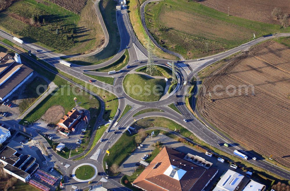 Rheinfelden from above - Die sternförmige Struktur des Turbokreisverkehrs verbindet die Beuggener Straße mit der Kreisstraße und der Schildstraße und ist mit 88 Metern Außendurchmesser der größte Deutschlands. Daneben befindet sich eine Filiale der McDonald's Deutschland Inc.The astral structure of the roundabout connects the streets Beuggener Strasse, Kreisstrasse and Schildstrasse. With an outer diameter of 88 metres it is the largest roundabout of Germany. Next to it a store of McDonald's Germany Inc. was built.