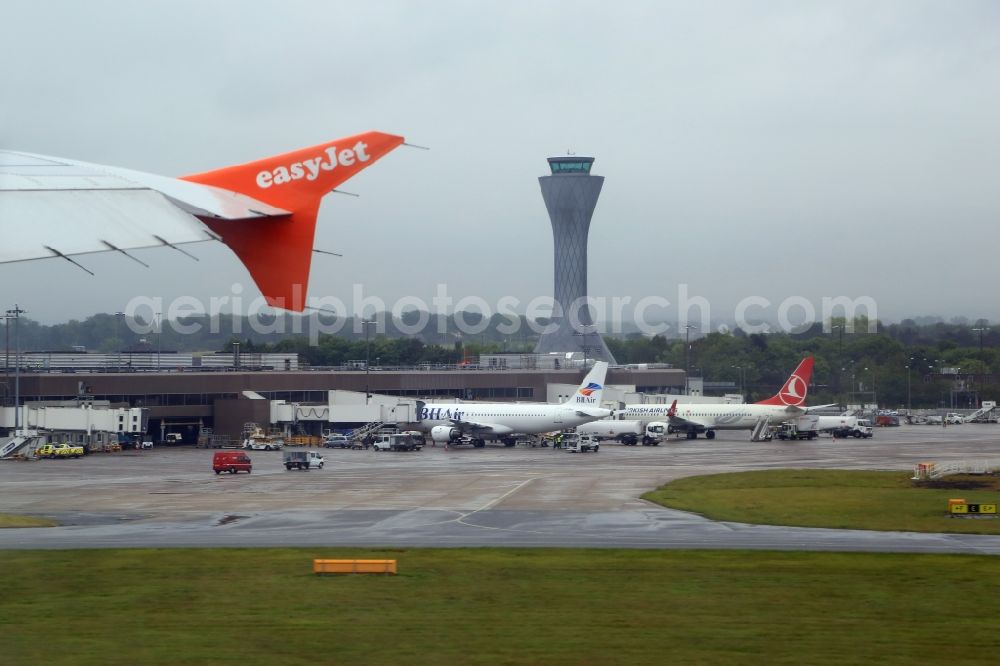 Aerial image Ingliston - Departing Easyjet Airbus A319 and view to the tower of the airport Edinburgh in Ingliston in Schottland, United Kingdom