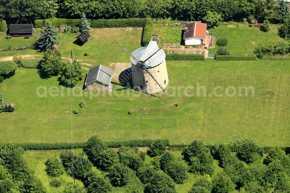 Aerial photograph Weißensee - In the Gruenstedter road from Weissensee in Thuringia is the tower windmill. The Sixteen Square Dutch windmill is completely intact but not functional. The attraction can be seen by appointment