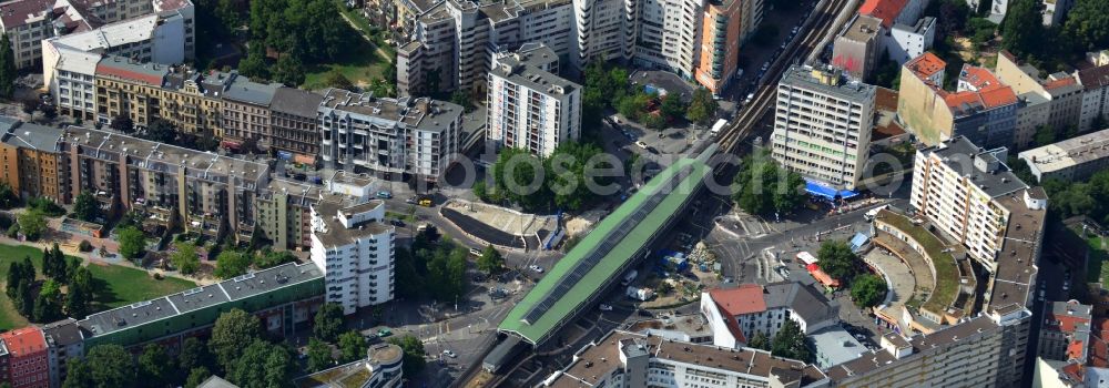 Aerial photograph Berlin - The Underground train station Kottnusser Tor is surrounded by the library Adalbertstreet and the Kreuzberg Merkezi, the centre of the district