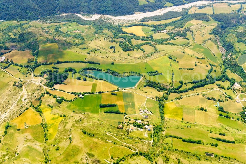 Aerial image La Roche-des-Arnauds - Riparian areas of bathing lake in La Roche-des-Arnauds in Provence-Alpes-Cote d'Azur, France