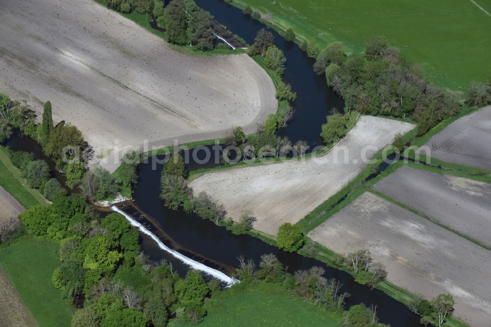 Aubeterre-sur-Dronne from the bird's eye view: Curved loop of the riparian zones on the course of the river Dronne in Aubeterre-sur-Dronne in Aquitaine Limousin Poitou-Charentes, France