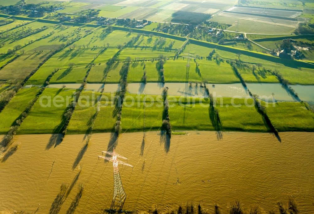 Rheinberg from above - Shore areas with flooded by flood level riverbed in the district Orsoy in Rheinberg in the state North Rhine-Westphalia, Germany