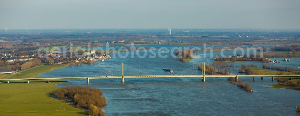 Kalkar from above - Shore areas with flooded by flood level riverbed on rhine bridgde in Rees in the state North Rhine-Westphalia