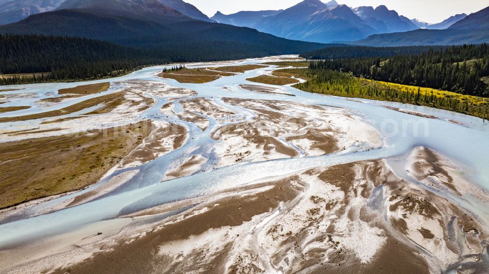 Aerial image Saskatchewan River Crossing - Shore areas exposed by low-water level riverbed North Saskatchewan River in Canadian Rocky Mountains, on street Icefields Parkway in Saskatchewan River Crossing in Alberta, Canada