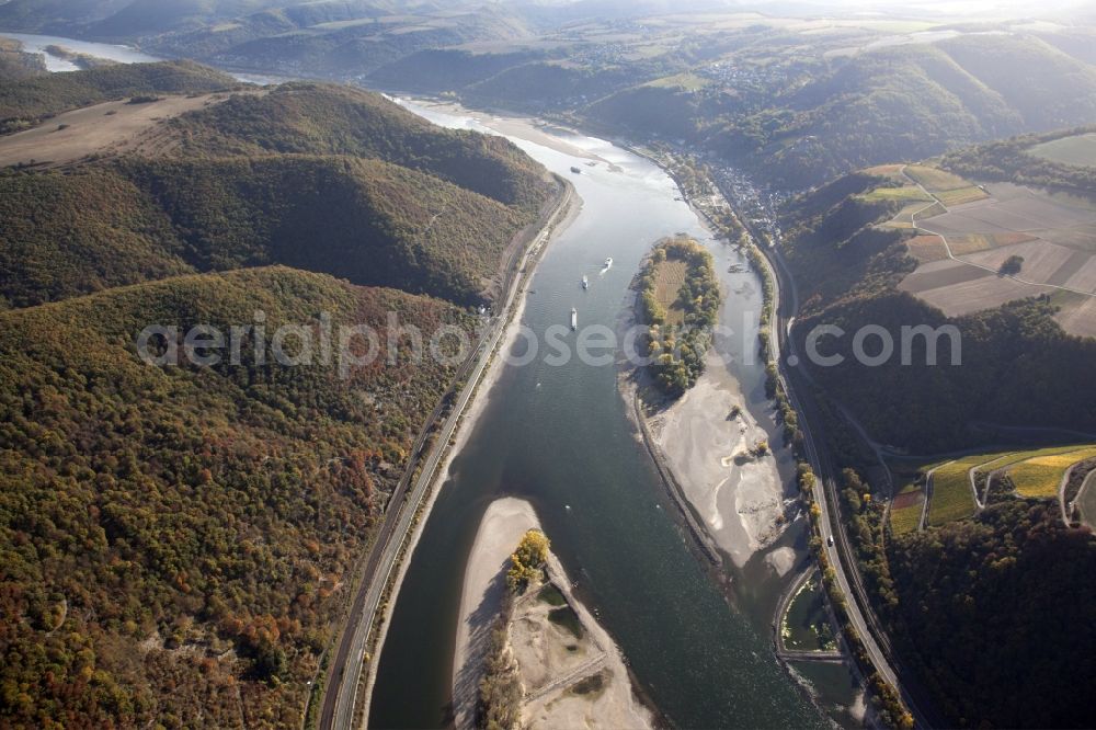 Bacharach from above - Shore areas exposed by low-water level riverbed on the Rhine river in Bacharach in the state Rhineland-Palatinate, Germany. Therein the island Bacharacher Werth. The larger part of the island is planted with vines