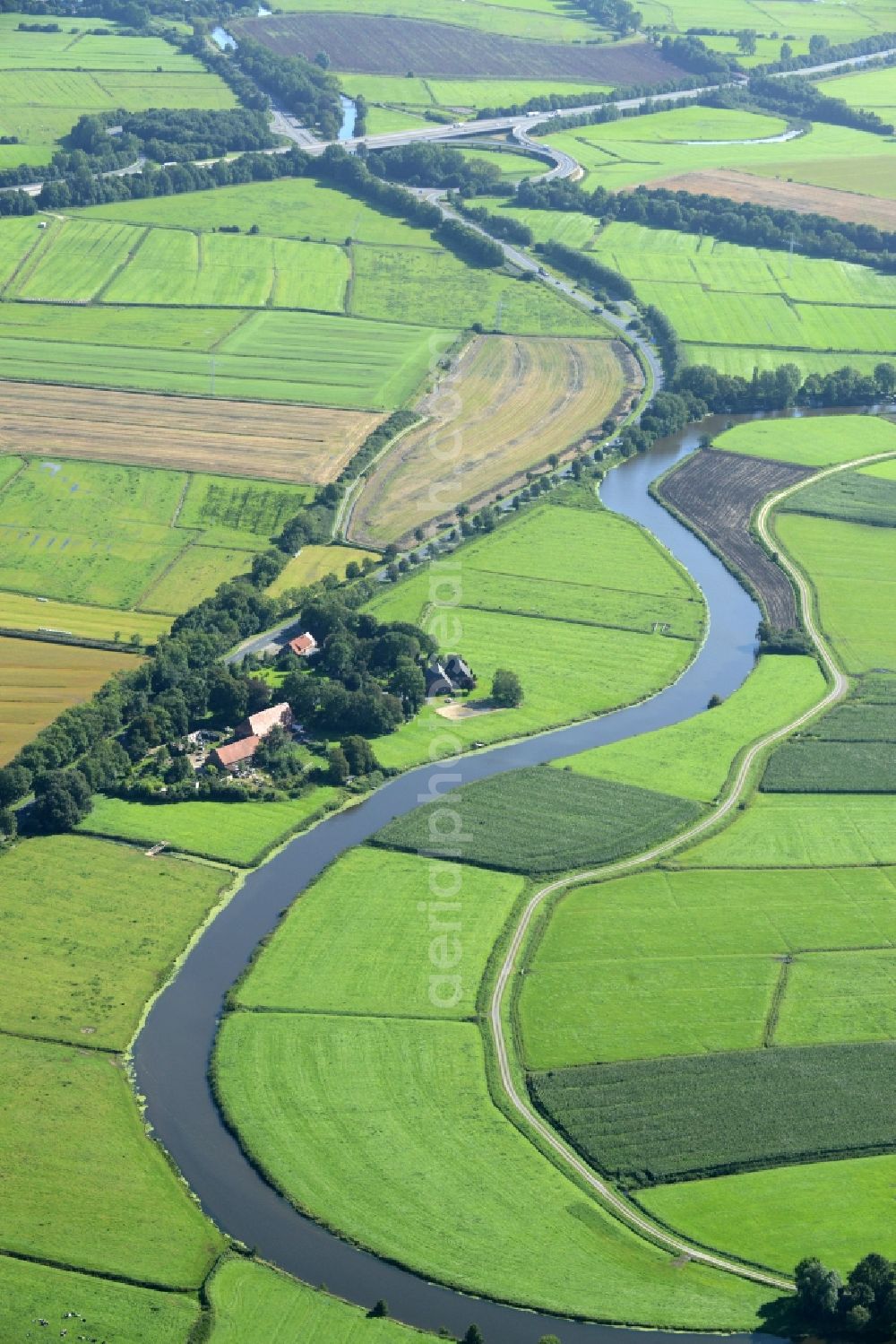 Loxstedt from the bird's eye view: Riparian zones on the course of the river Alte Lune in Loxstedt in the state Lower Saxony
