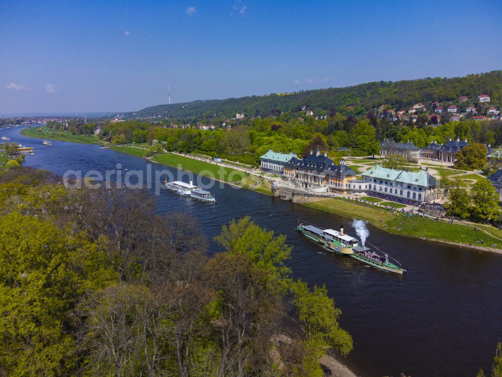 Dresden from above - Riparian zones on the course of the river of Elbe with Flottenparade historischer Schaufelraddampfer on street Carolabruecke in Dresden in the state Saxony, Germany