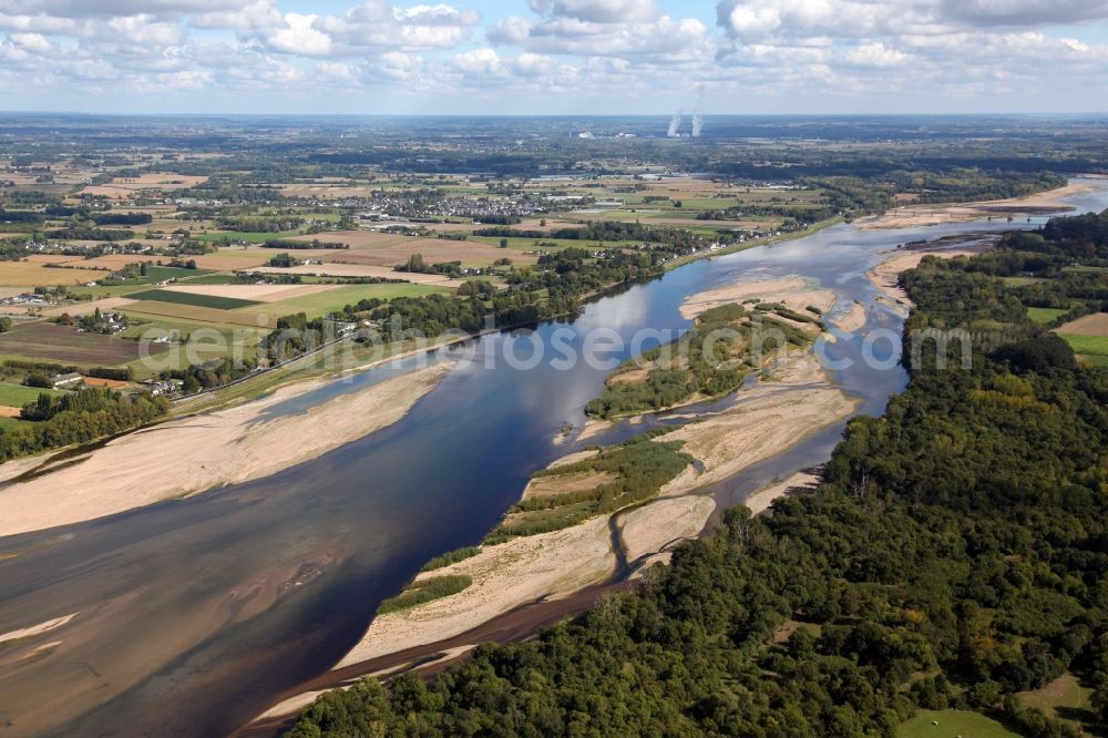Varennes sur Loire from above - Riparian zones on the course of the river of the Loire in Varennes sur Loire in Pays de la Loire, France. In the riverbed there are always changing sandbanks. In the background the cooling towers of the nuclear power station Chinon